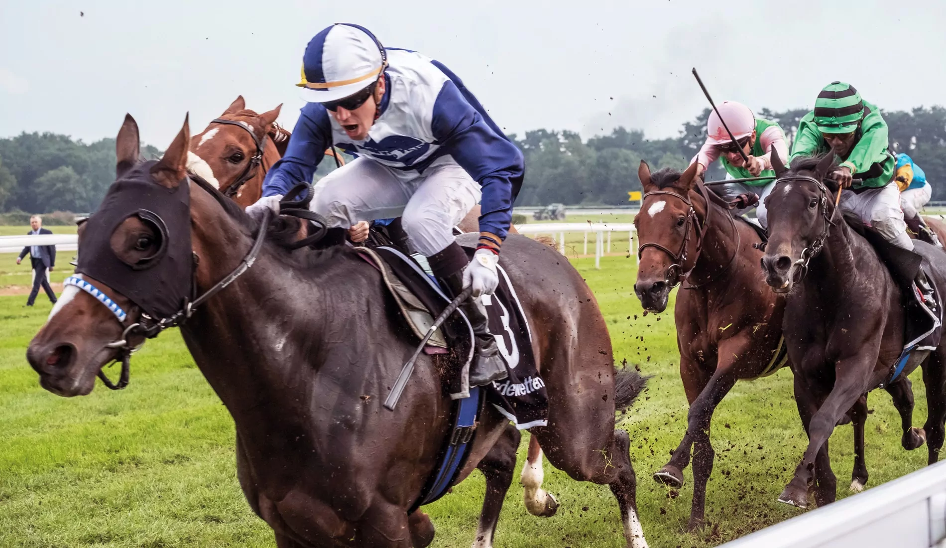 Dynamic shot of a jockey racing a horse at full speed, showcasing action and speed.